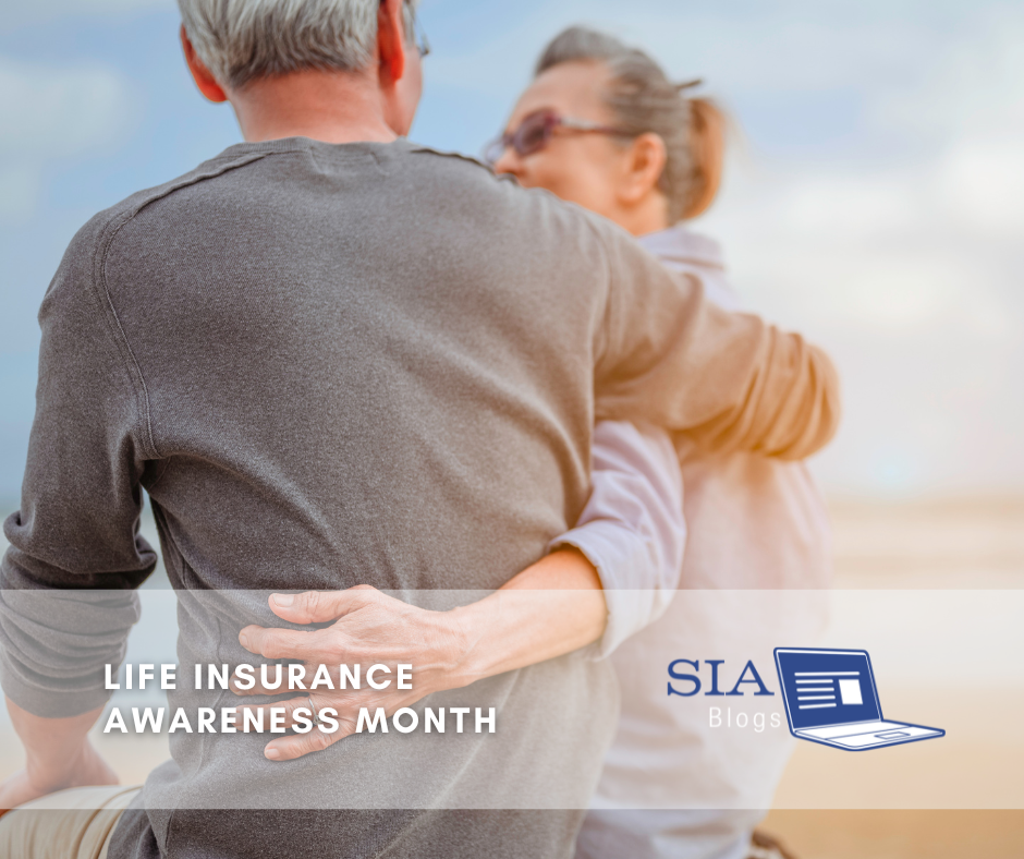 An older couple sits closely together with the man's arm around the woman, promoting Life Insurance Awareness Month. The "SIA Blogs" logo appears in the lower-right corner.