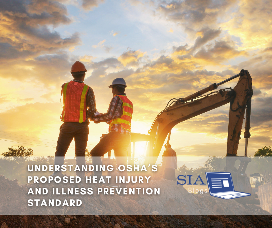 Two construction workers wearing reflective safety vests and hard hats stand near an excavator at a worksite during sunset, discussing OSHA's proposed heat injury and illness prevention standard.